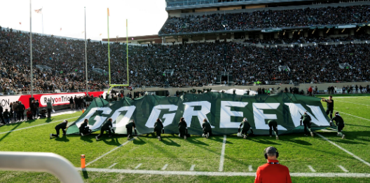 “Go Green” Flag on field at Spartan Stadium 
